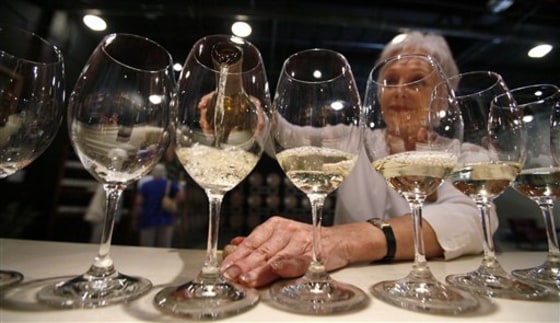 Elizabeth Richardson pours wine for a tour group at the Chateau Ste. Michelle winery in Woodinville, Wash.